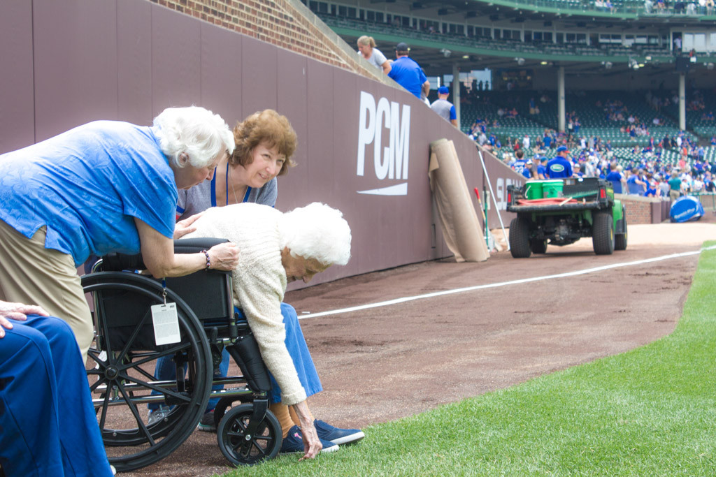 Touching the grass in Wrigley Field