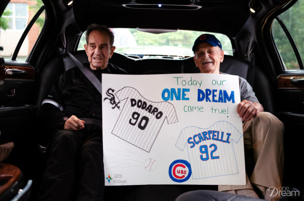 holding a sign in the limo