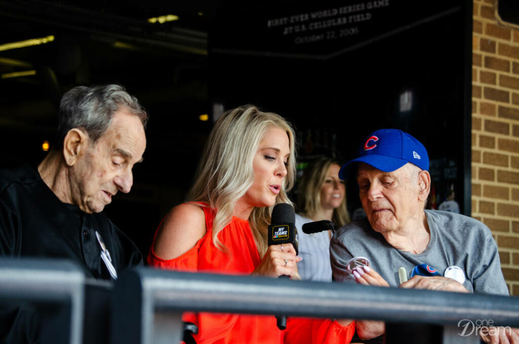 Lou, Kelly Crull and Nick on TV at the crosstown classic